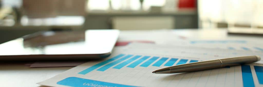 Silver pen lie at important paper on table in empty office closeup. Paperwork job trade balance bank credit loan money invest payment irs commerce partnership concept