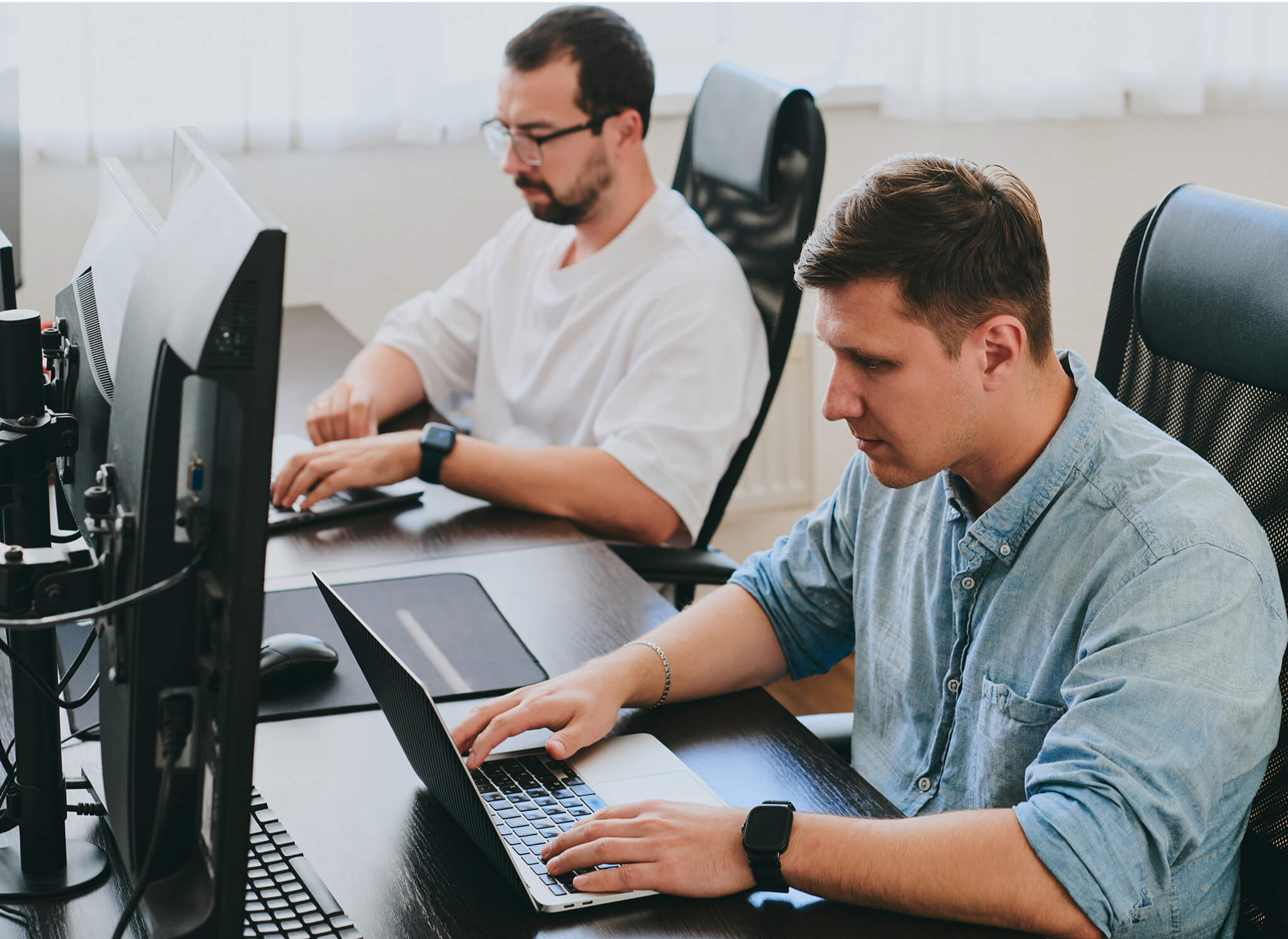 portrait-two-professional-male-programmers-working-computer-diverse-offices-modern-it-technologies-development