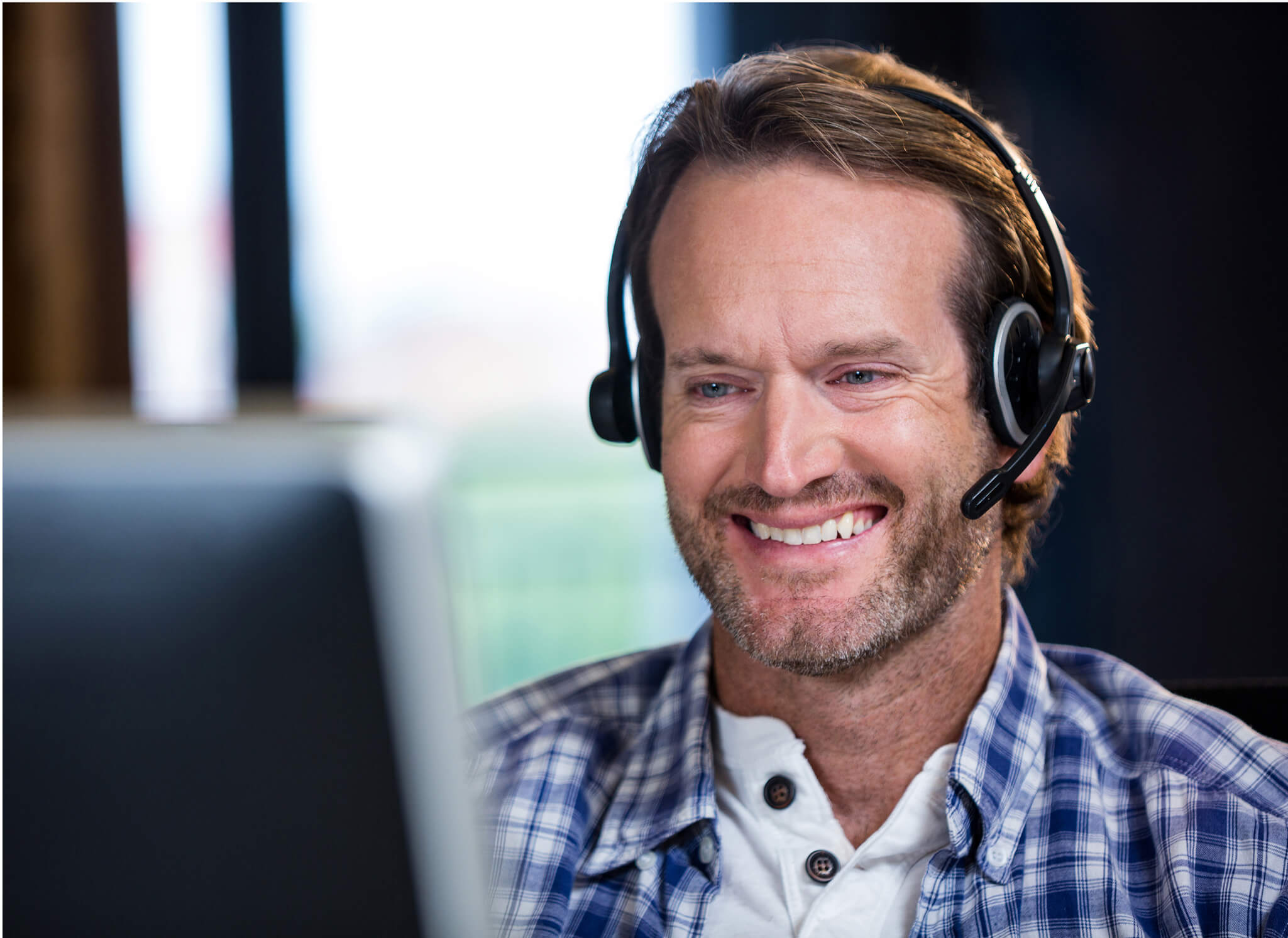 smiling-businessman-working-computer 1 smiling-businessman-working-computer 1