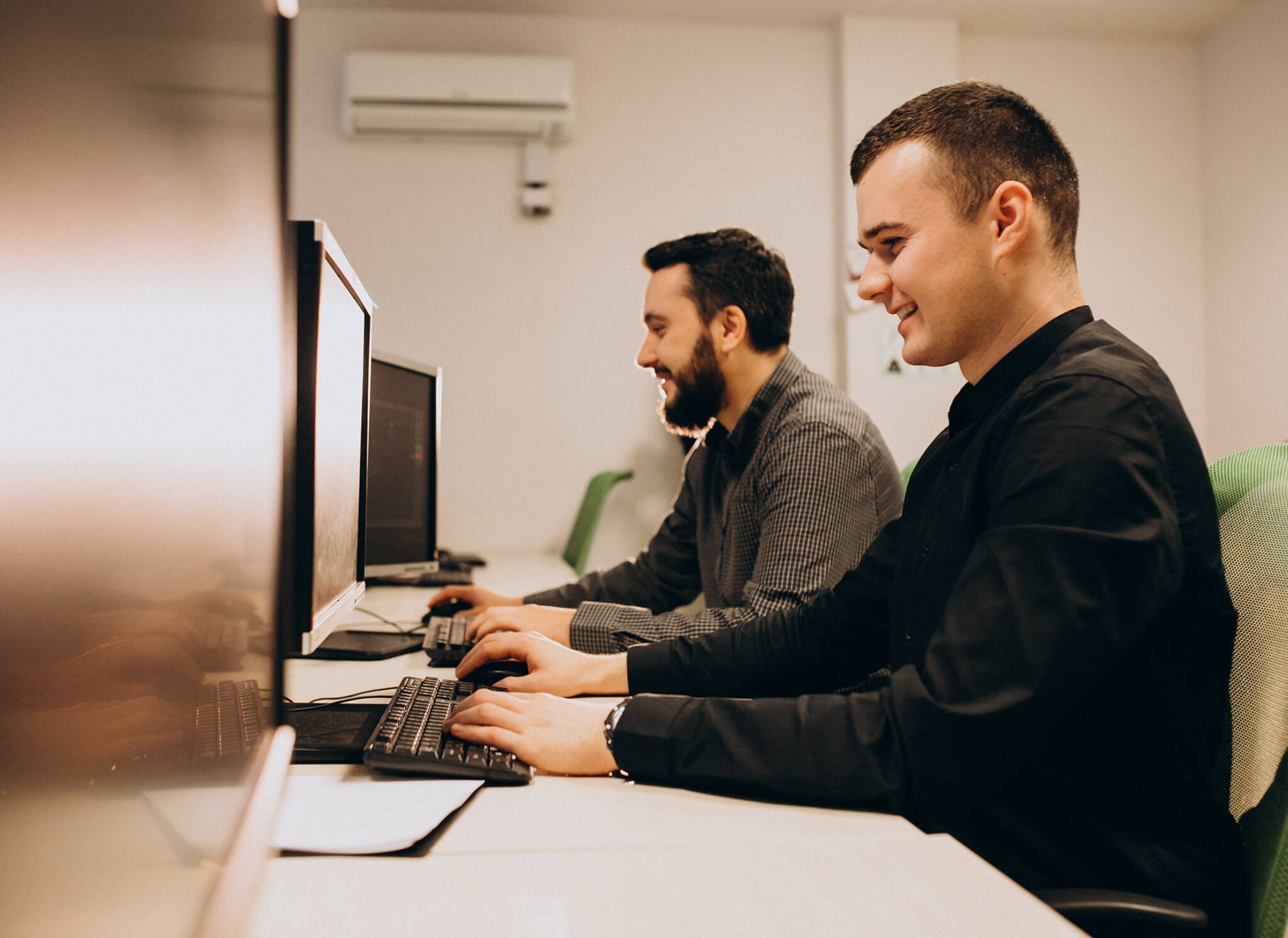 young-male-web-designers-working-computer (2) 1